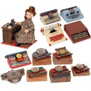 11 Toy Typewriters and an Office Doll