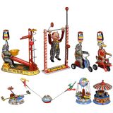 8 Lithographed Circus Tin Toys and Fairground Carousels, c. 1950