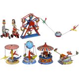 8 Lithographed Circus Tin Toys and Fairground Carousels, c. 1950